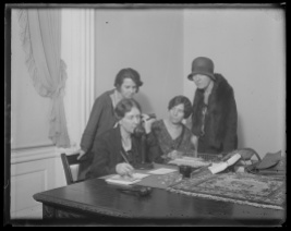 Anna Kelton Wiley, founder of The National Woman's Party telephones Doris Stevens, chairman of the InterAmerican Commission of Women at the Haugue, to ascertain whether the World Code now being drawn up by the Codification Conference of International Law will be based on sex discrimination, April 3, 1930. In the photograph, left to right: Anita Pollitzer of South Carolina; Anna Kelton Wiley; Alice Paul; and Elsie Hill of Connecticut. Photo by Harris and Ewing, courtesy Library of Congress Prints and Photographs Division Washington, D.C. http://www.loc.gov/pictures/item/hec2013005824/